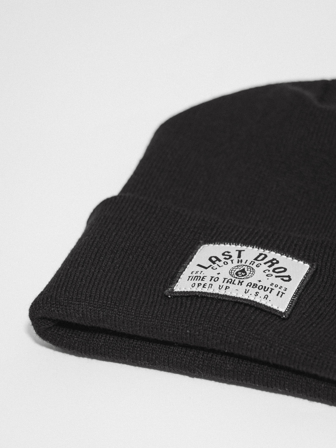 Get ready for the cold weather with this stylish beanie. Made from high-quality materials, this black beanie features an embroidered patch for a unique touch. Stay warm and stay fashionable.