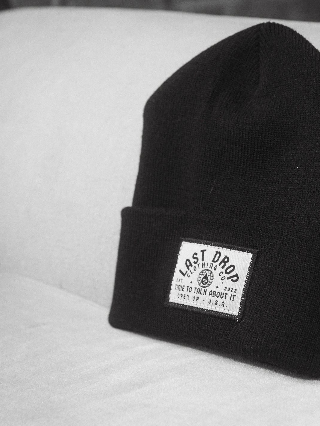 A global-inspired beanie featuring an embroidered patch.